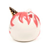 Angled view of a white ceramic unicorn money box featuring a golden horn, pink mane, pink cheeks, closed eyes, and a coin slot on top.