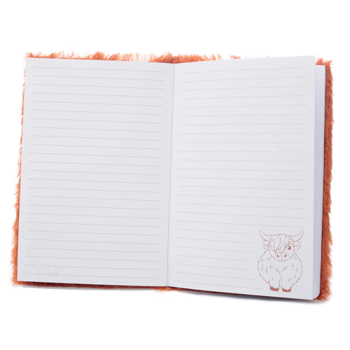 Interior view of an open A5 notebook with a fluffy orange cover, revealing lined white pages and a subtle Highland Coo illustration in the bottom right corner of the right page.
