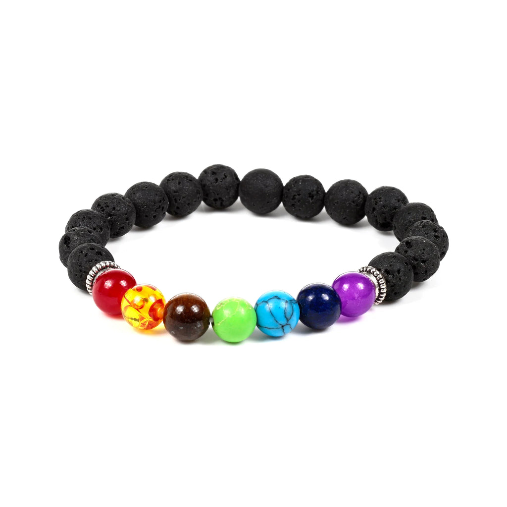 Angled view of a chakra lava rock gemstone bracelet, comprising porous black lava rock beads and seven smooth colourful beads, including red, yellow, brown, green, turquoise, dark blue, and purple, accented with silver-coloured ridged spacers.