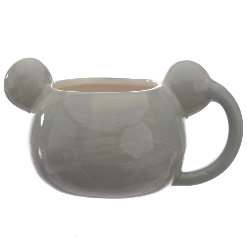 Side view of a glossy grey ceramic koala-shaped mug with prominent rounded ears and a curved handle. The mug's interior is a light cream colour.