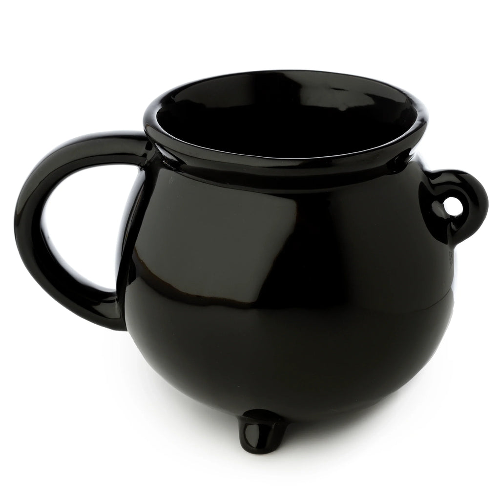 Angled view of a glossy black ceramic cauldron-shaped mug, featuring a curved handle, three support feet, and a decorative side loop.