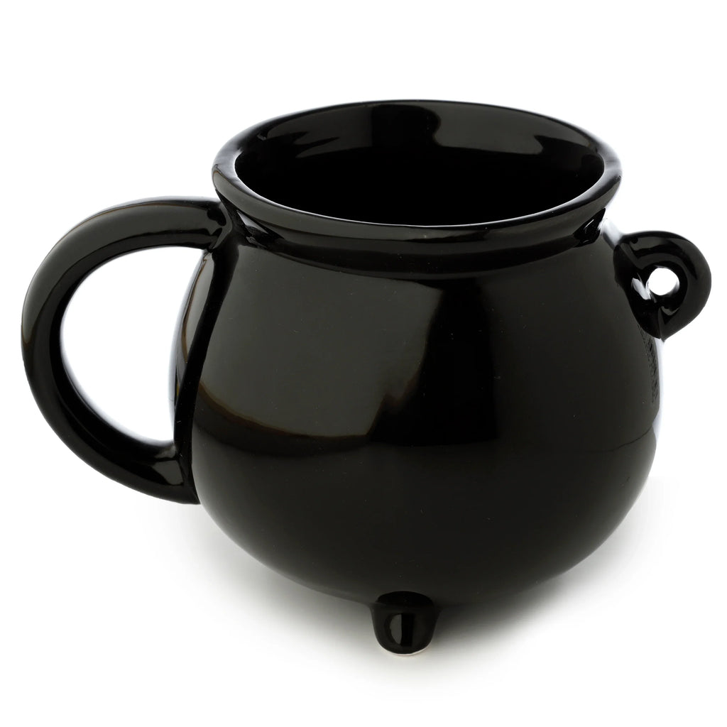 Angled view of a glossy black ceramic cauldron-shaped mug, featuring a prominent curved handle on the left, a small decorative loop on the right, and standing on a visible foot.