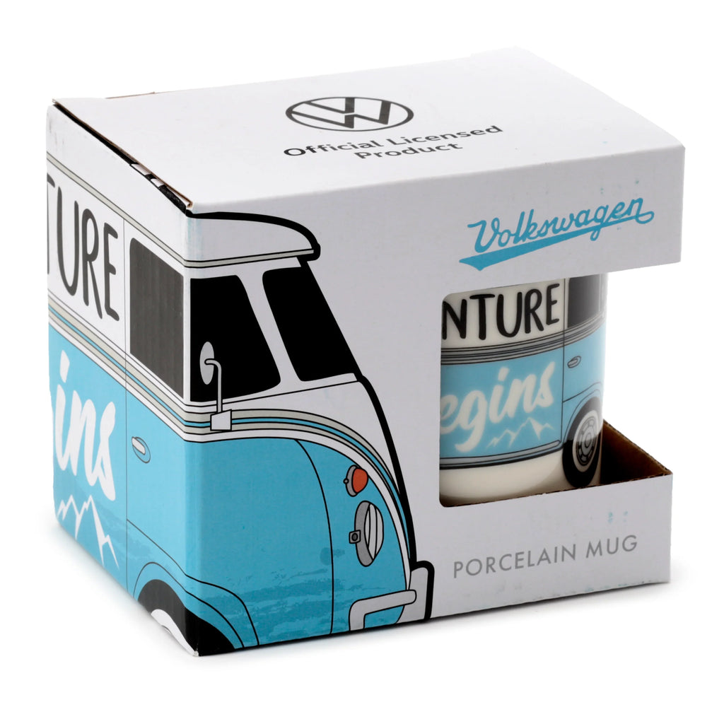 Angled view of a porcelain mug, partially visible inside its blue and white packaging box. The box and the mug feature a Volkswagen T1 Camper Bus design, with the mug showing Adventure text, and the box displaying Official Licensed Product and Porcelain Mug.