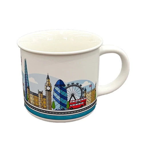 Angled view of a white porcelain fine rimmed mug, depicting a colourful London skyline illustration featuring the Shard, Big Ben, Gherkin, London Eye, and a red double-decker bus, with its handle in clear view.