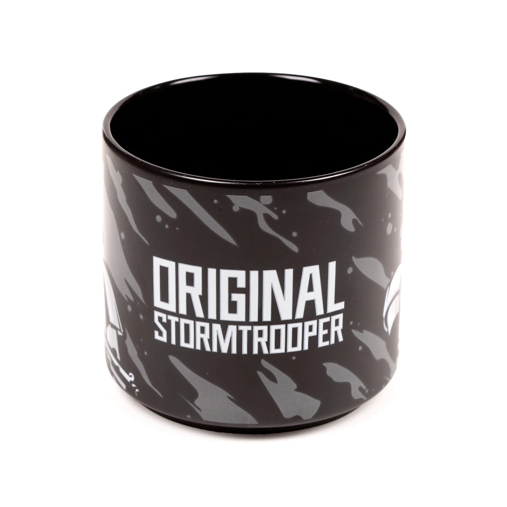 Large black porcelain mug showing white 'ORIGINAL STORMTRPPER' text, grey abstract patterns, and a glimpse of a Stormtrooper helmet design, with a black interior.