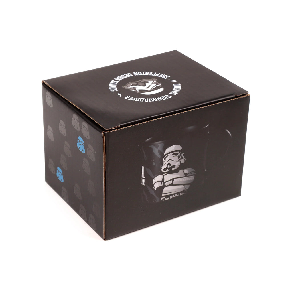 Angled view of a black box, the packaging for a large porcelain mug. It features an 'Original Stormtrooper' illustration on the front, a circular 'Original Stormtrooper' logo on the top, and repeating grey and blue Stormtrooper helmet patterns on the side.