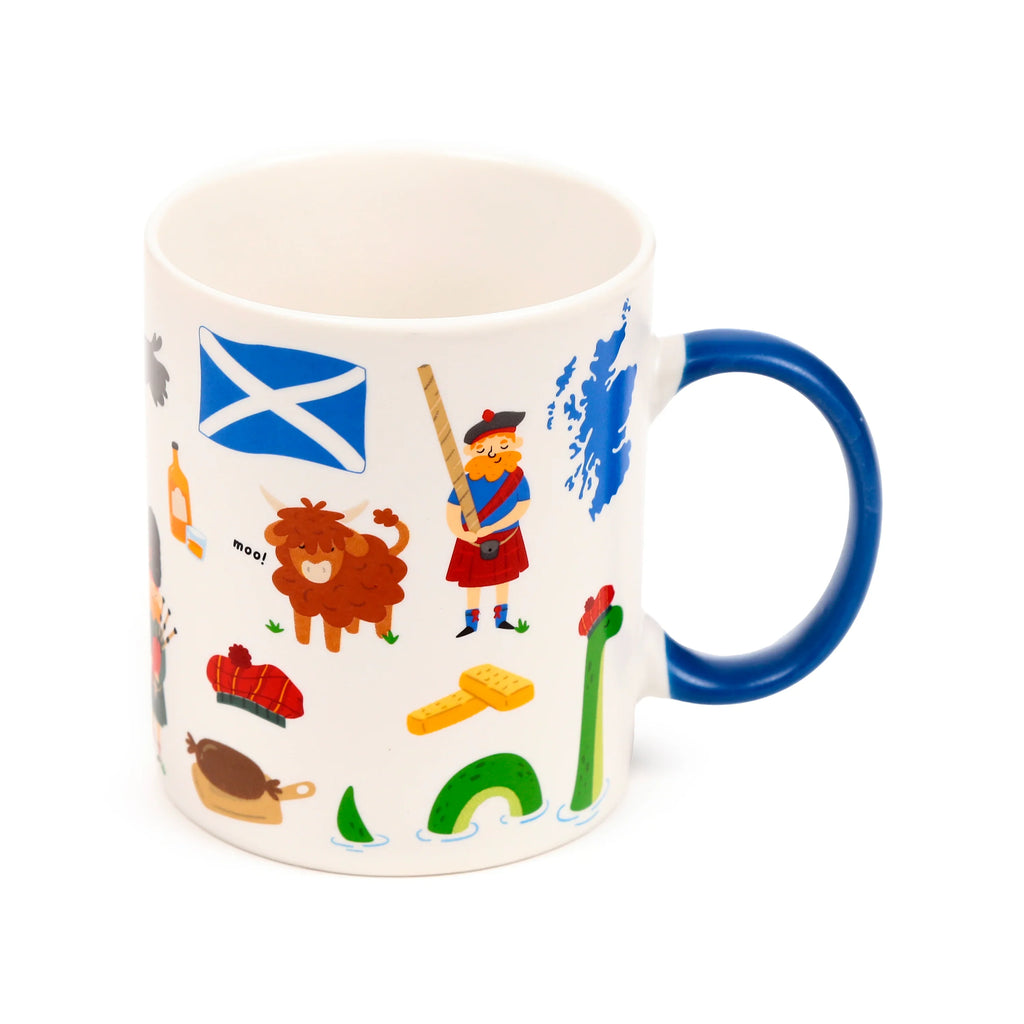 Angled view of a white porcelain mug with a blue handle, depicting colourful Scottish souvenir illustrations including the Saltire flag, a Highland cow, a man in a kilt, and the Loch Ness Monster.