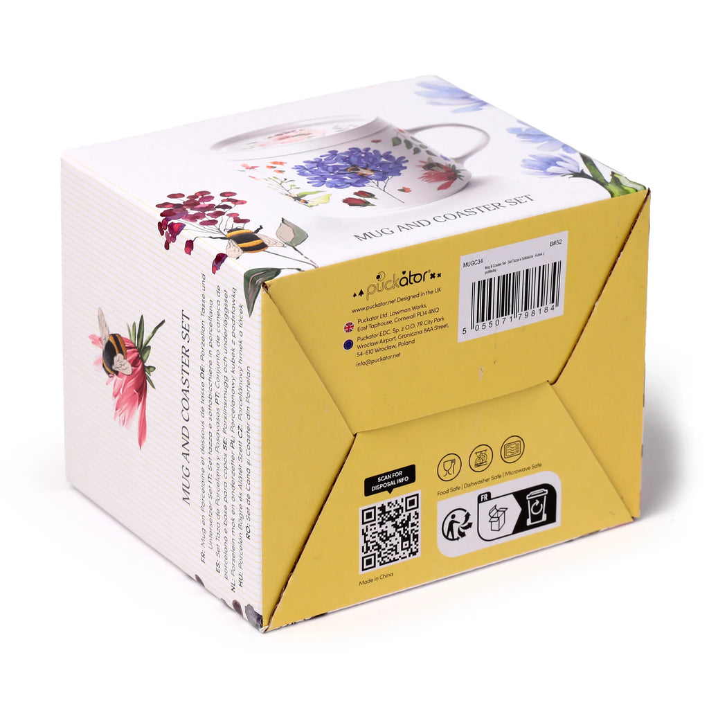 Angled view of the product packaging for a porcelain mug and coaster lid set. The white box features vibrant floral and bee illustrations on its top and side, with visible product details, safety icons, and a barcode on another side.