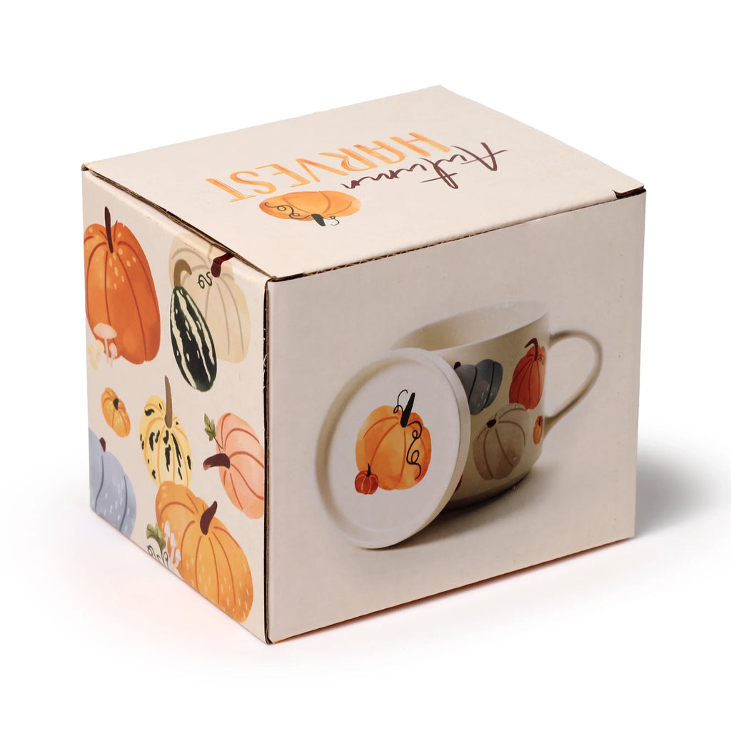 Angled view of the Porcelain Mug & Coaster Lid Set 'Autumn Harvest' themed packaging box. The cream-coloured box features colourful pumpkin and gourd illustrations, and an image of the matching mug and coaster lid.