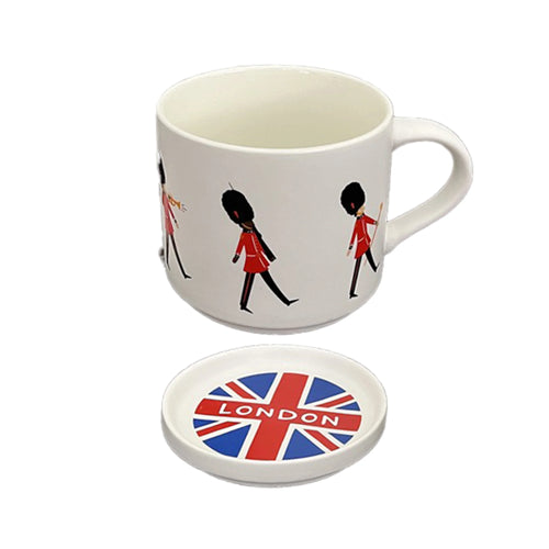 Angled view of a white porcelain mug decorated with red London Guardsmen, paired with a round coaster lid featuring a Union Jack flag and 'LONDON' text.