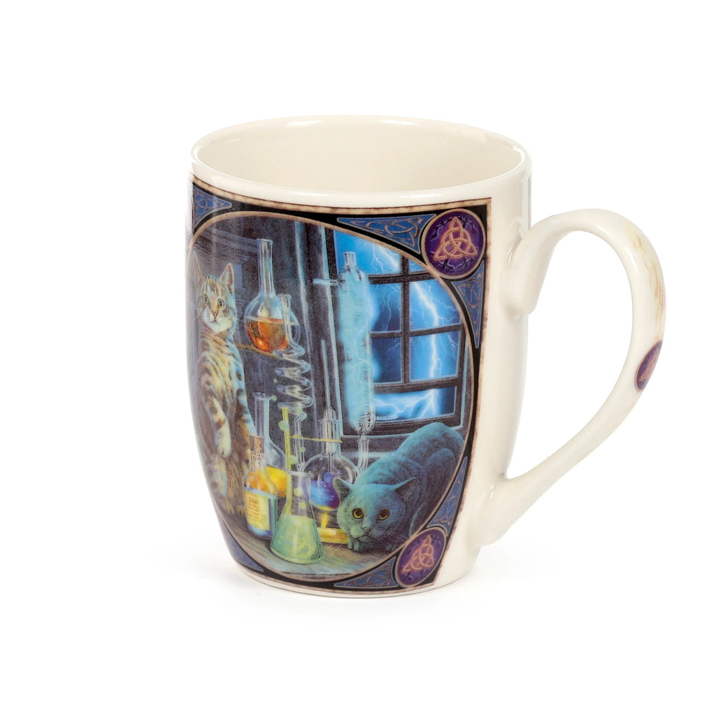 Angled view of a cream porcelain mug featuring a Lisa Parker Jekyll & Hyde Cats design, depicting two cats amidst laboratory beakers with lightning outside, bordered by blue and purple Celtic knots.