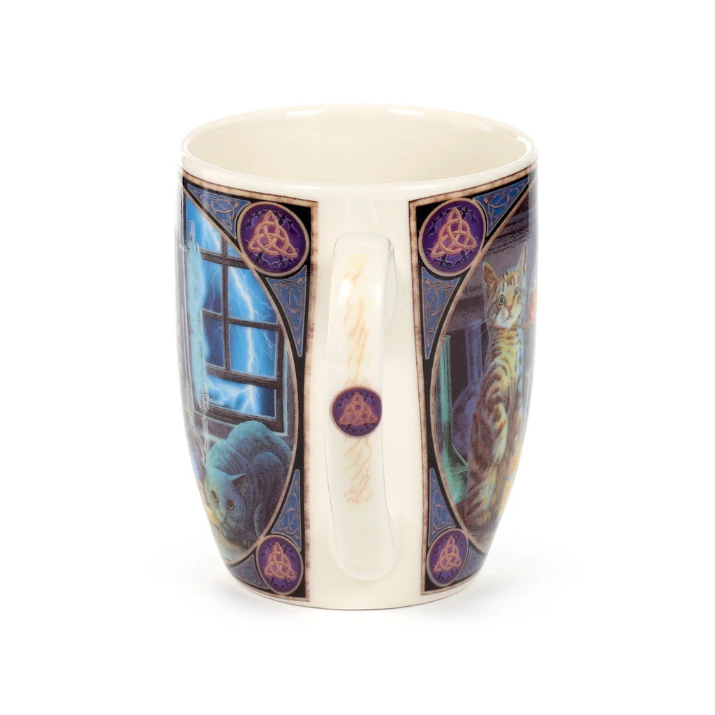 Angled view of a porcelain mug, showing a cream interior and handle. The mug features two contrasting illustrated panels: one of a dark cat looking out a window during a lightning storm, and another of a tabby cat by a window. Both panels are bordered with purple and gold Celtic knot designs, with a matching emblem on the handle.