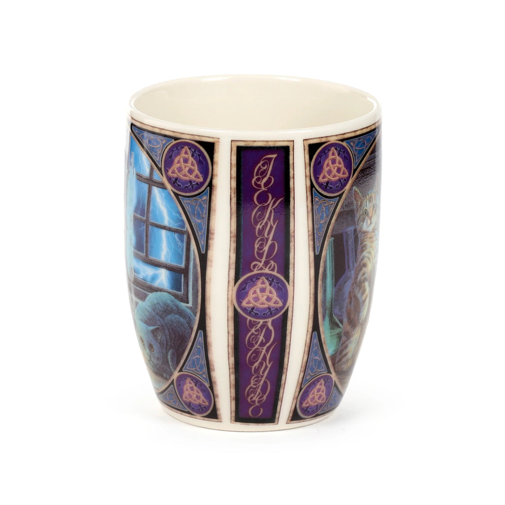 Angled view of a porcelain mug featuring a purple and blue design. One side shows a blue-grey cat looking at lightning, while the other depicts a tabby cat. The mug displays 'Jekyll & Hyde' text vertically, flanked by Celtic knot and bat motifs.