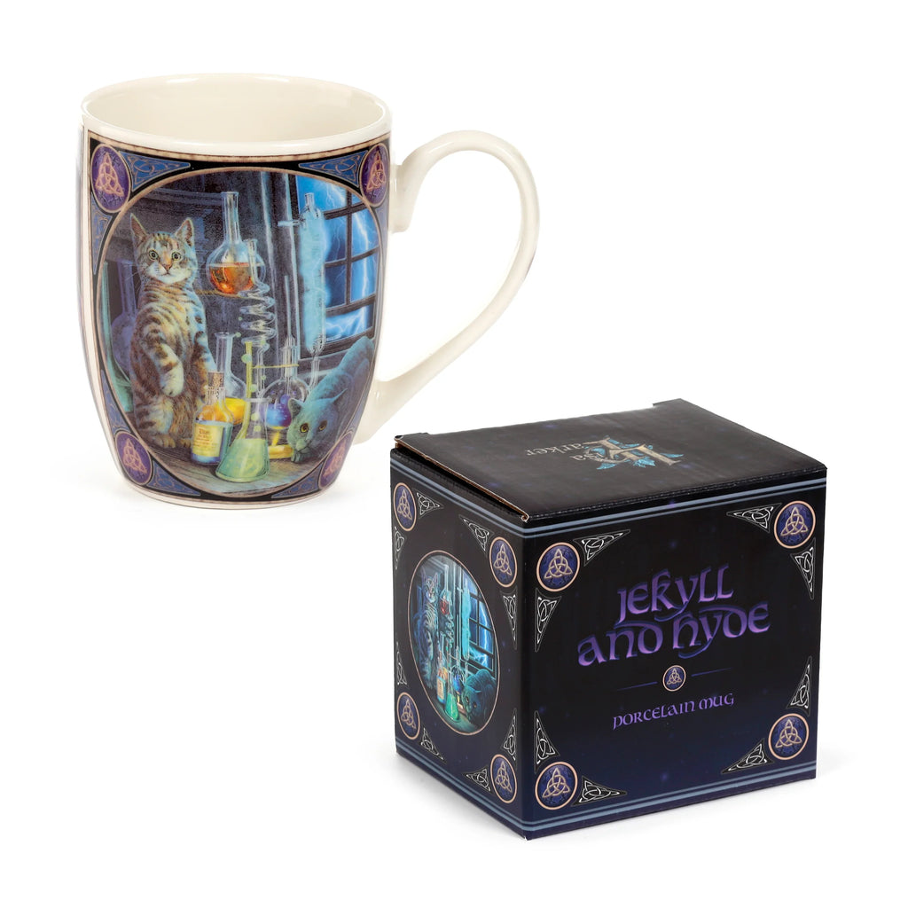 Angled view of a cream-coloured porcelain mug featuring a detailed illustration of a tabby cat and a dark cat amongst laboratory equipment, framed by Celtic knot patterns. The accompanying dark blue packaging box, positioned next to the mug, also displays 'Jekyll and Hyde Porcelain Mug' text and similar decorative motifs.