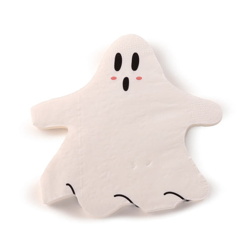 Overhead view of a white ghost Halloween paper napkin with black eyes, a black mouth, and pink cheeks.