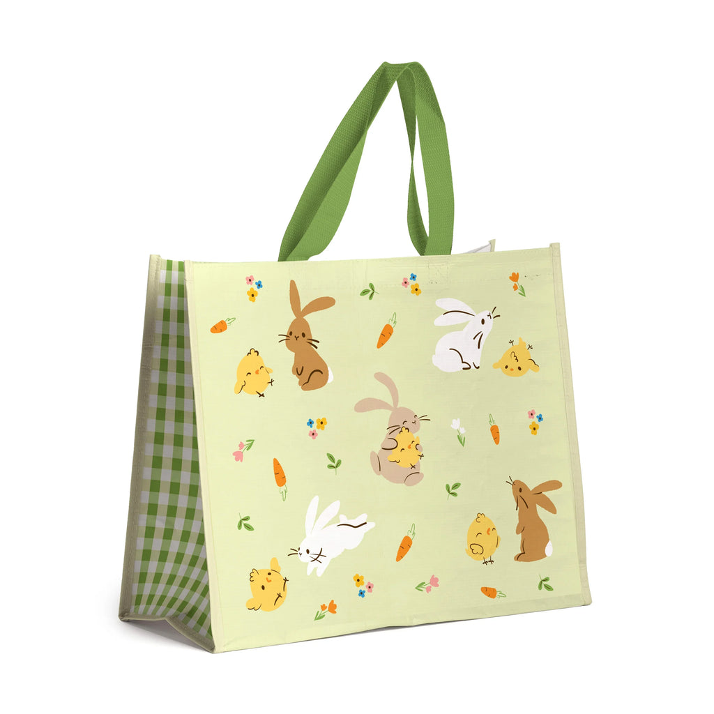 Durable reusable shopping bag with a pale green front, illustrated with brown and white bunnies, yellow chicks, orange carrots, and colourful spring flowers. Features green fabric handles and a green and white gingham side panel.