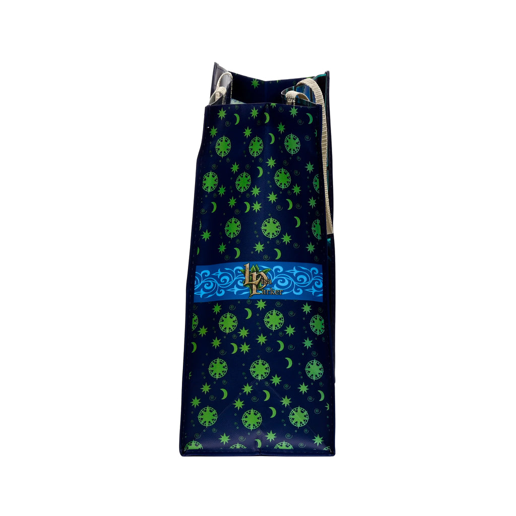 Side view, showing the patterned side panel of a dark blue durable reusable shopping bag. It features a repeating green pattern of stars, crescent moons, and circular motifs, along with a blue ornate band with 'Lisa Parker' text. Light-coloured fabric handles are visible at the top.
