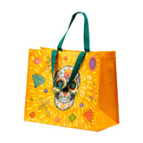 Orange reusable shopping tote bag featuring a colourful Day of the Dead sugar skull design surrounded by festive patterns, with teal handles, on a white background.
