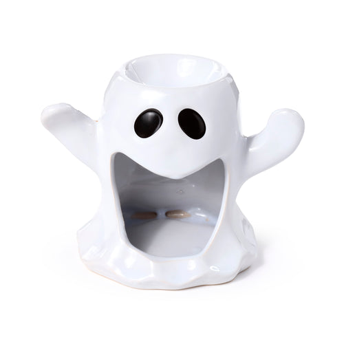 Angled view of a white ceramic ghost oil and wax burner, featuring black oval eyes, a large open mouth, and a top bowl.
