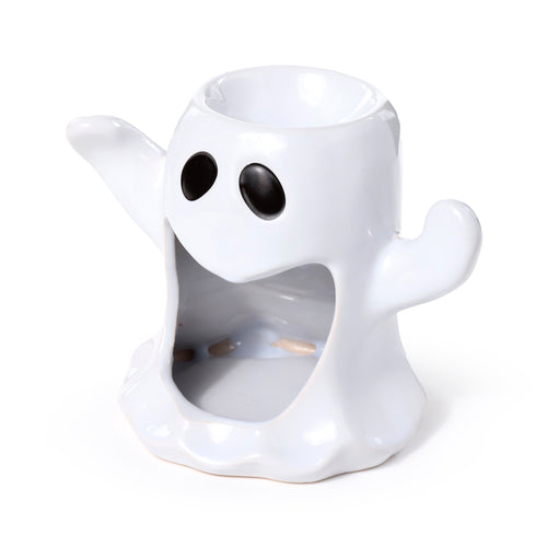 Angled view of a white ceramic ghost oil and wax burner, featuring black eyes and an open, smiling mouth.