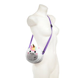 Plush white unicorn cross body bag with a gold horn, rainbow mane, and grey snout, featuring a purple adjustable strap, displayed on a mannequin.