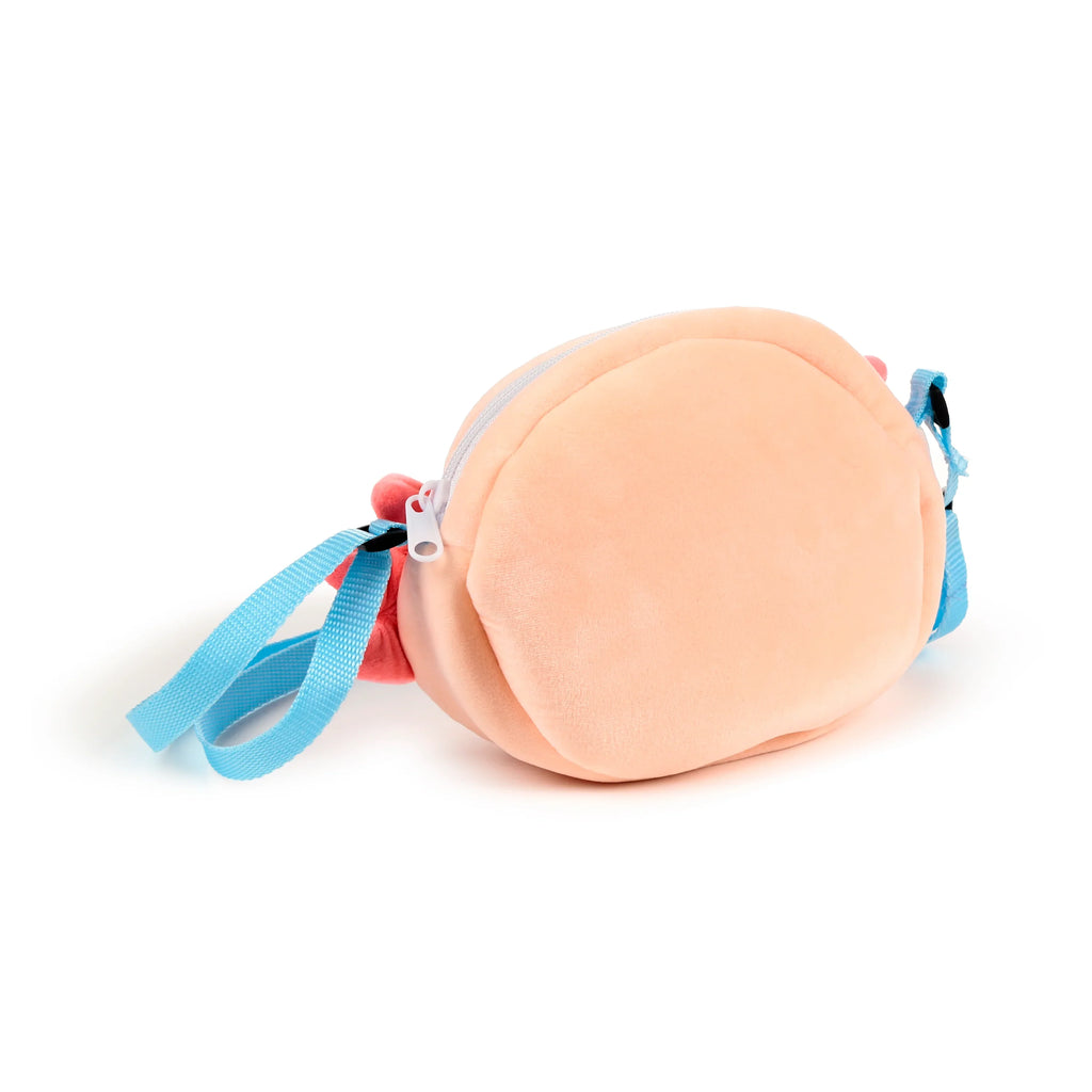 Angled view of a light peach plush cross body bag with a white zip fastening and a light blue adjustable strap, featuring small pink decorative details on the left side.