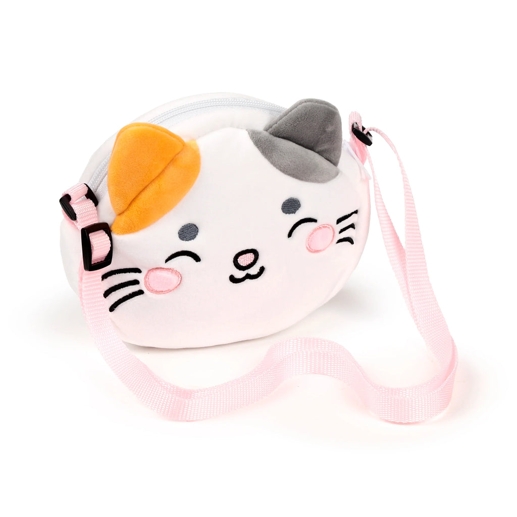 Front view of a white, orange, and grey plush cat crossbody bag, featuring embroidered closed eyes, pink cheeks, and a pink adjustable strap.