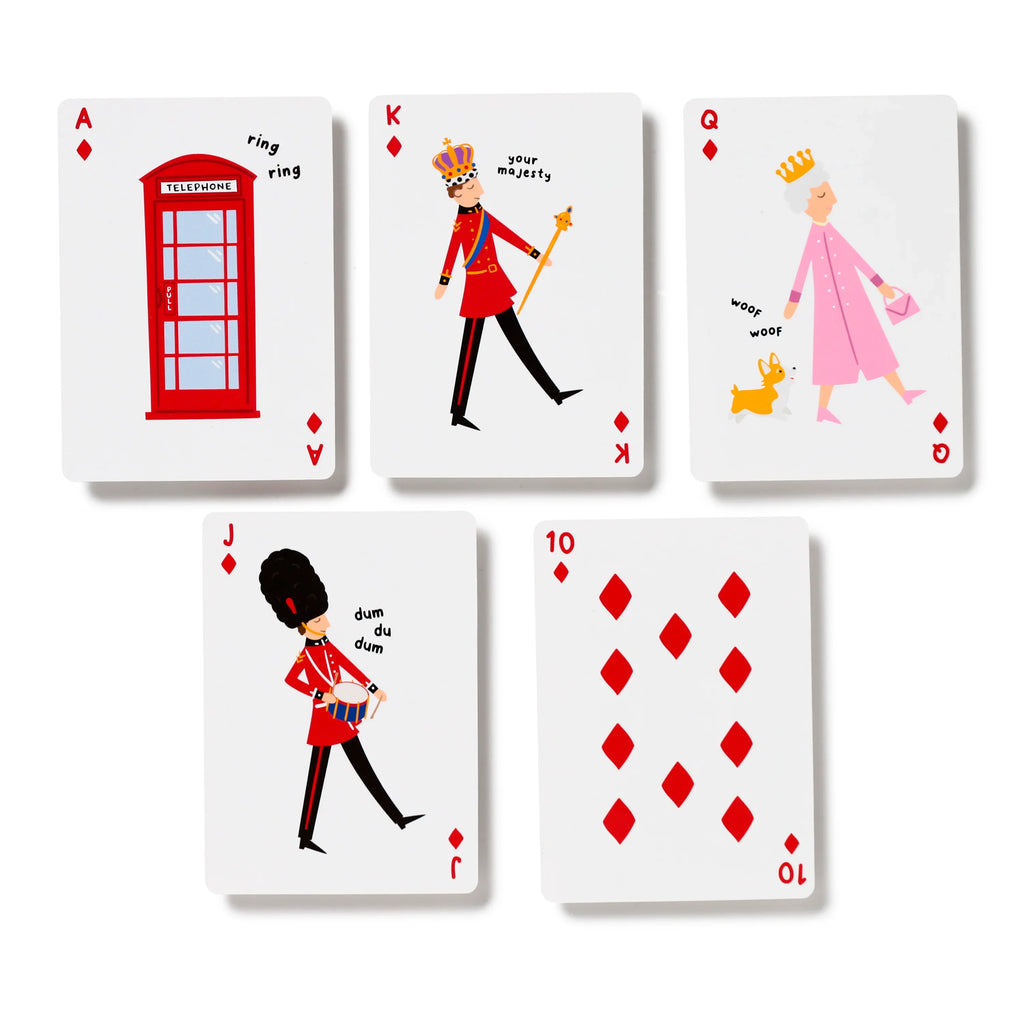 Flat lay display of five standard playing cards from a London souvenir deck, showing red diamond suits and themed illustrations: an Ace with a red telephone box, a King in uniform, a Queen with a corgi, and a Jack as a Grenadier Guard, plus a Ten of Diamonds.