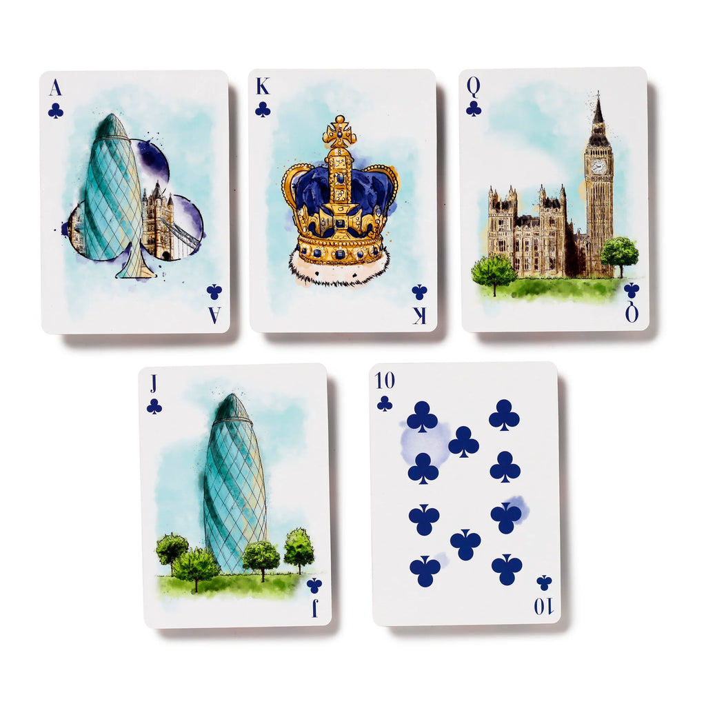 Overhead view of five white playing cards from a London tour themed deck. The watercolour illustrations depict London landmarks and British symbols, including the Gherkin, Tower Bridge, Imperial Crown, Houses of Parliament, and Big Ben. The visible cards are the Ace, King, Queen, Jack, and Ten of Clubs, with blue pips.