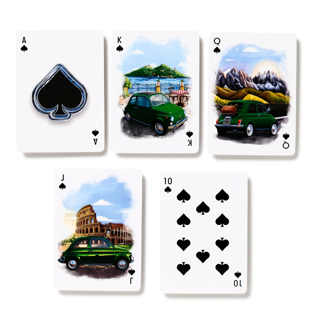 Overhead view of five playing cards from a Standard Deck of Playing Cards - Fiat 500, spread out on a white background. The spade suit cards, including Ace, King, Queen, Jack, and Ten, are visible. The Ace displays a large spade emblem, whilst the King, Queen, and Jack feature colourful illustrations of green Fiat 500 cars set against Italian landscapes and landmarks like the Colosseum, and the Ten shows multiple spade pips.