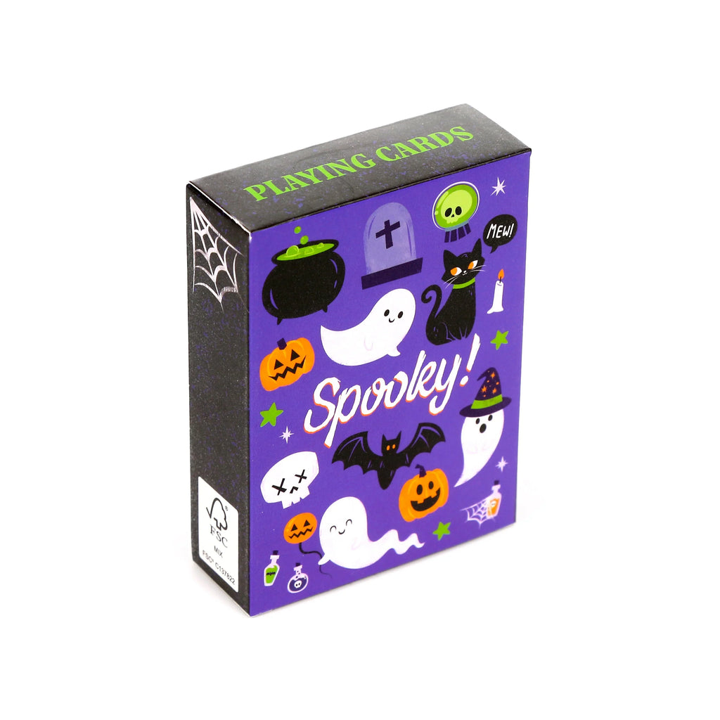 Angled view of a purple playing cards box, its front adorned with 'Spooky!' text and various Halloween illustrations including ghosts, pumpkins, and a black cat, with 'PLAYING CARDS' visible on the top surface.
