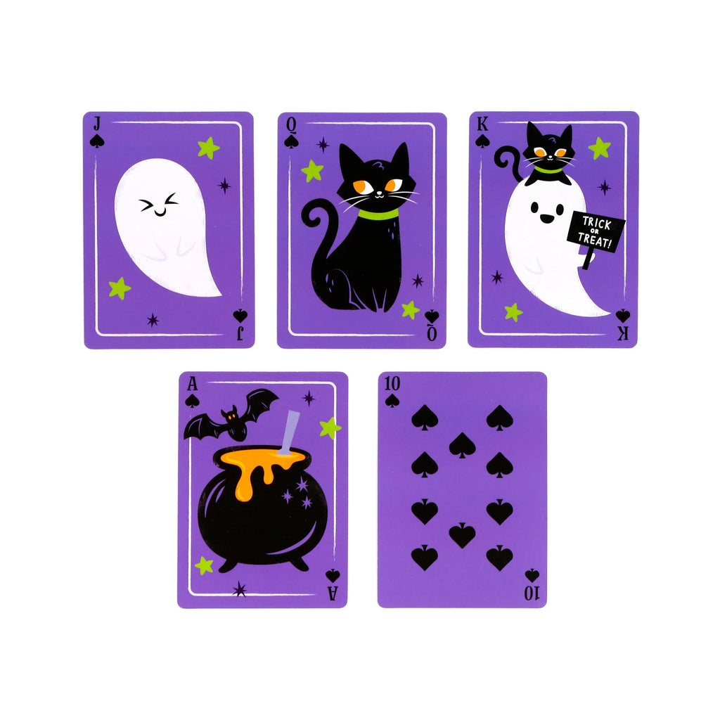 Display of five purple Spooky playing cards, featuring illustrations of a winking ghost, a black cat, a ghost holding a 'Trick or Treat' sign, a cauldron with a bat, and ten spade pips.