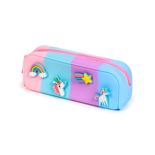 Angled view of a multicoloured silicone pencil case, featuring pink, blue, and purple blended hues. It has a pink zip closure and raised unicorn, rainbow, and shooting star charms.