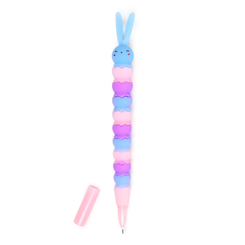 Front view of a pastel blue rabbit pen with long ears, a smiling face, and rosy cheeks, featuring a stacked body in alternating pink, purple, and light blue wavy segments. The light pink cap is detached, revealing the fine tip.