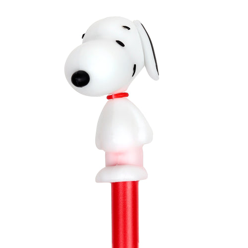 Close-up of a red erasable pen, topped with a white Snoopy character featuring black ears, eyes, nose, and a red collar, viewed in profile.