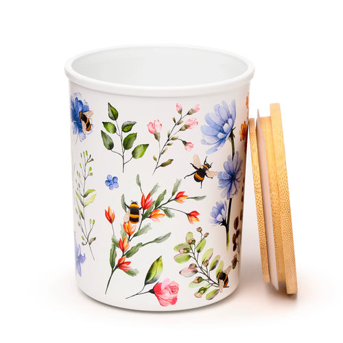 White storage jar with Nectar Meadows floral and bee pattern, angled view displaying the detached light brown bamboo lid.