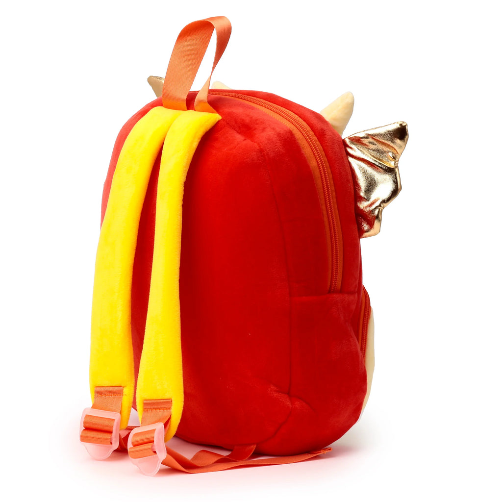 Side view of a red plush kids school dragon backpack with yellow shoulder straps, an orange top handle, and golden wings.
