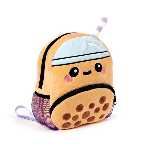 Front angled view of a tan plush kids school backpack designed as a boba bubble tea cup, featuring a cartoon face, brown boba pearls, a light blue lid, a striped purple and white straw, black zippers, and purple mesh side pockets.