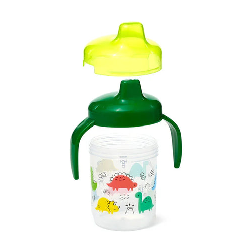 Disassembled reusable shatterproof sippy cup, showing its clear base with colourful dinosaur illustrations, dark green handled lid, and translucent yellow spout cover.