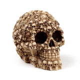 Angled view of a bone-coloured multi-skulls head decoration, intricately designed with numerous small skulls and bones forming the larger skull shape.