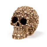 Angled view of a beige Multiple Skulls Head Decoration ornament, intricately crafted from miniature skulls and bones, against a white background.
