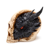 Angled view of a large black dragon's head with red eyes and textured scales, appearing to emerge from a detailed, bone-coloured skull ornament.