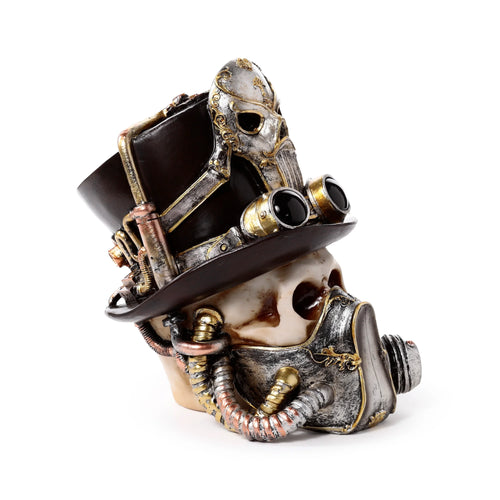 Angled view of a decorative steampunk skull ornament, showcasing its light-coloured skull, dark brown top hat with metallic gold and silver detailing, and an elaborate gas mask featuring dark lenses and copper-toned tubes.