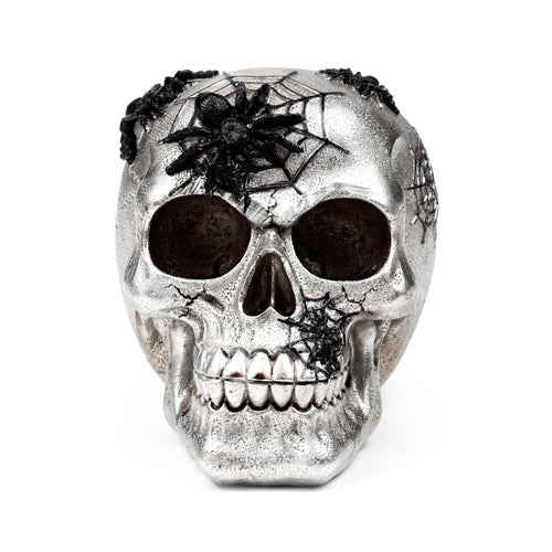 Front view of a textured silver skull ornament, featuring black spiders and webs.
