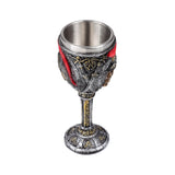 Decorative goblet with embossed swords, skulls, and red details, featuring a distressed silver-tone finish with gold ornate patterns on its bowl, stem, and base, and a metallic inner cup, shown from an elevated, angled view on a white background.