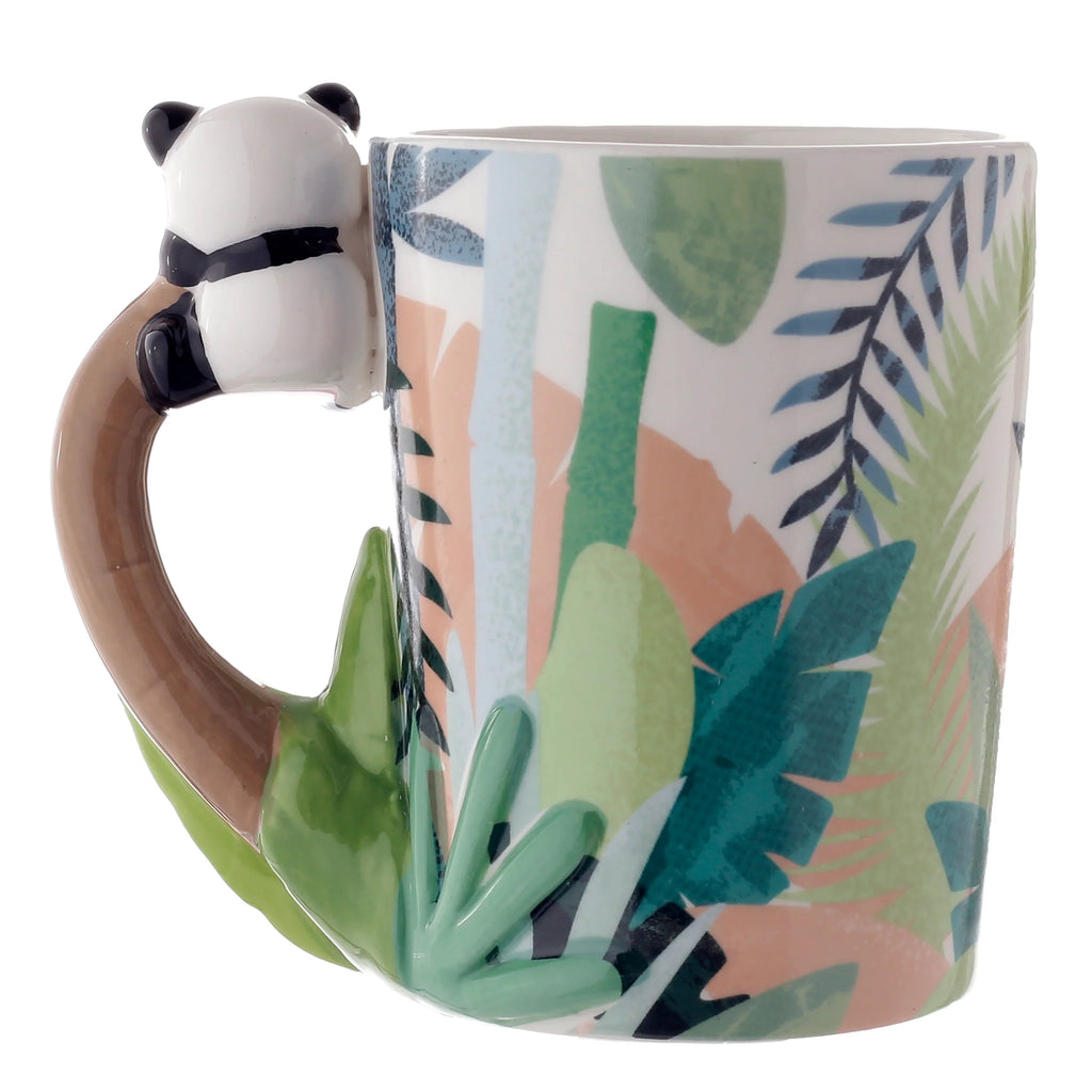 Angled view of a white ceramic mug, prominently displaying its unique brown branch-shaped handle with a black and white panda figure clinging to the top. The mug's body features a tropical leaf pattern in shades of green, blue, and peach.