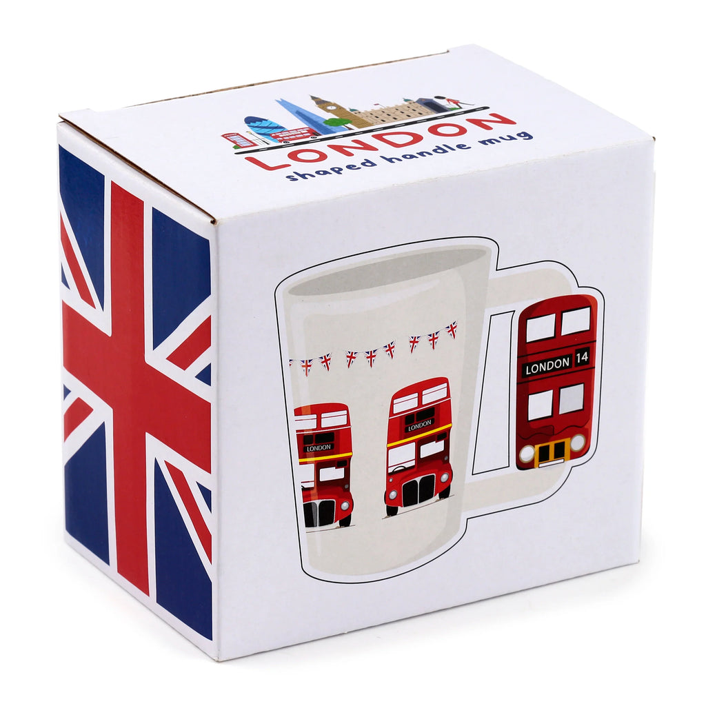 Angled view of the white Routemaster London Bus ceramic shaped handle mug's retail box, showcasing a Union Jack flag and the mug's design with red buses and London landmarks.