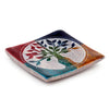 Angled view of a vibrant multi-coloured soapstone incense burner dish, featuring an intricate white Tree of Life carving.