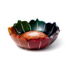 Angled view of a multi-coloured carved soapstone lotus incense burner dish with red, orange, yellow, green, blue, and purple petals and a central mottled brown well.