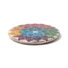 Angled view of a circular, carved soapstone incense burner dish, showcasing an intricate multi-coloured chakra lotus mandala design on its top surface.